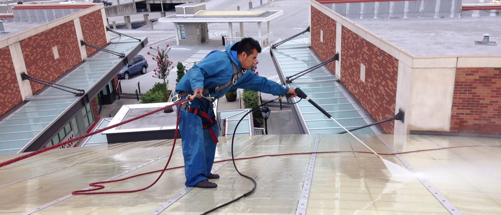 industrial roof cleaner does pressure washing on pvc roof